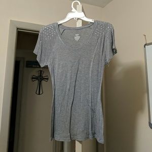 Gray T shirt with metal studs on should